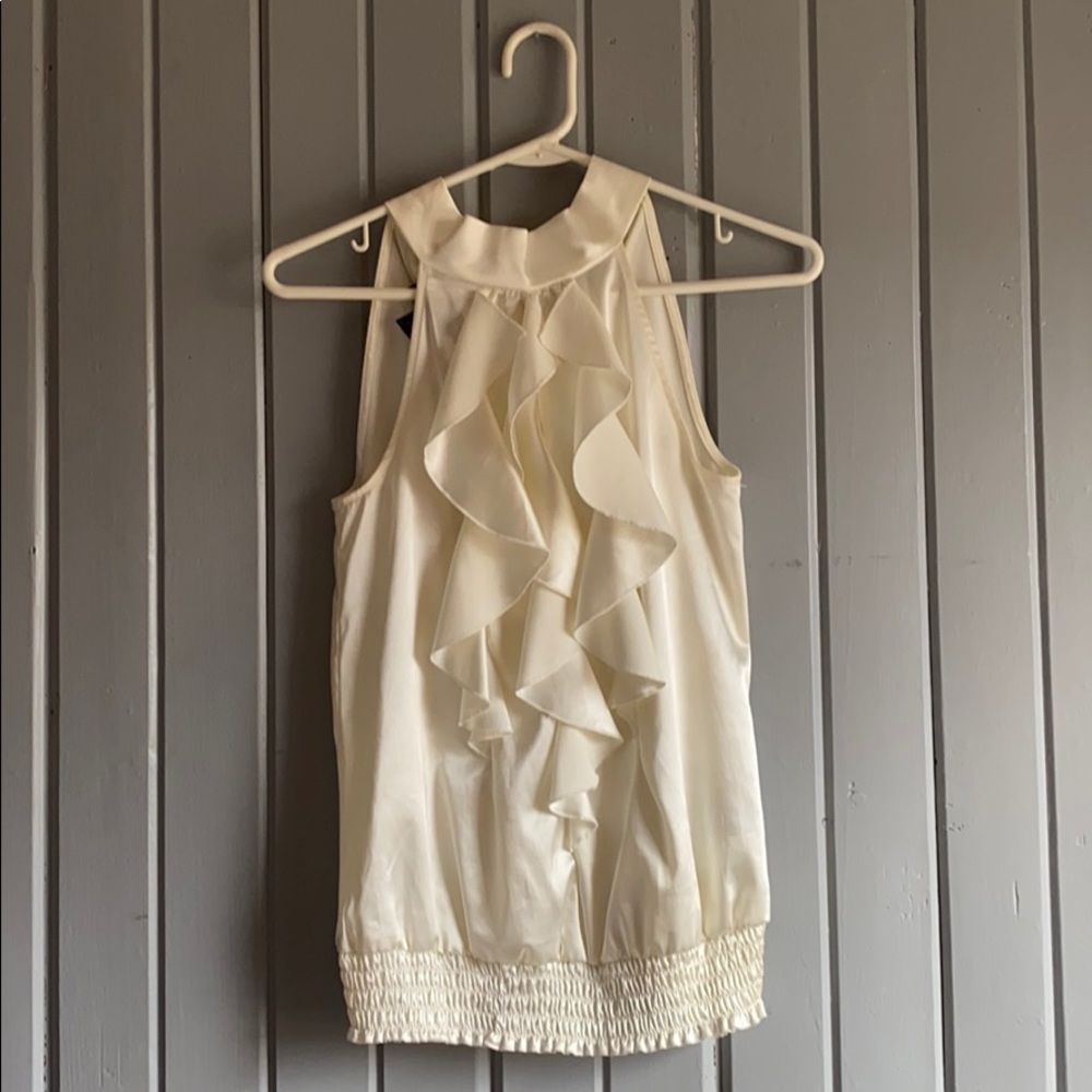 Silk cream ruffle tank which ties around the neck